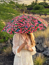 Load image into Gallery viewer, woman holding a lightweight, portable japarra sun umbrella parasol to help her to block the sun's damaging UV rays that cause burning, premature aging and skin cancer.