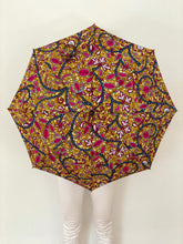Load image into Gallery viewer, woman holding a lightweight, portable japarra sun umbrella parasol to help her to block the sun's damaging UV rays that cause burning, premature aging and skin cancer.
