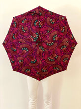 Load image into Gallery viewer, Block damaging UV sun rays and the rain with this stunning umbrella, also called parsol, in pink and purple 100% cotton. Save your skin and protect your investment in skincare by stopping the sun's damaging UV rays, carry this lightweight japarra umbrella everywhere. This is a beautiful sun umbrella, also called a parasol, in 100% cotton colorful prints.