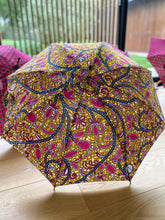 Load image into Gallery viewer, beautiful japarra sun umbrella, also called a parasol, in 100% cotton colorful prints.Lightweight and easy to carry with you everywhere to block the suns's damaging UVA and UVB rays that cause premature aging and burning.
