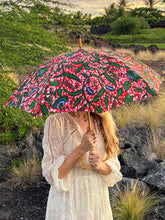 Load image into Gallery viewer, woman holding a lightweight, portable japarra sun umbrella parasol to help her to block the sun&#39;s damaging UV rays that cause burning, premature aging and skin cancer.