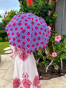 japarra sun umbrella parasol used to block the damaging UV rays from the sun that cause burning and aging. Lightweight, handheld pink parasol sun umbrella.