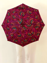 Load image into Gallery viewer, Block damaging UV sun rays and the rain with this stunning umbrella, also called parsol, in pink and purple 100% cotton. Save your skin and protect your investment in skincare by stopping the sun&#39;s damaging UV rays, carry this lightweight japarra umbrella everywhere. This is a beautiful sun umbrella, also called a parasol, in 100% cotton colorful prints.