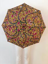 Load image into Gallery viewer, woman holding a lightweight, portable japarra sun umbrella parasol to help her to block the sun&#39;s damaging UV rays that cause burning, premature aging and skin cancer.